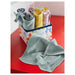 IKEA KRAMA mixed colour washcloths rolled and arranged in decorative box one laid flat on red surface