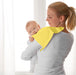 Parent holding baby with yellow IKEA KRAMA washcloth draped over shoulder after feeding