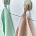  IKEA KRAMA washcloths spread out showing all four pastel colours in the pack