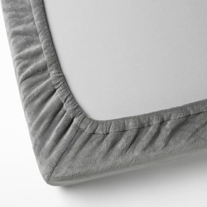 Close-up of IKEA KRANSSALVIA grey fleece fabric with elastic edge detailing