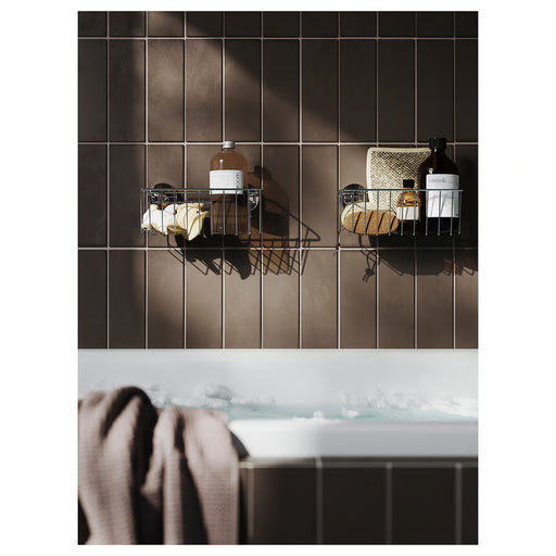  IKEA KROKFJORDEN shower basket mounted on white bathroom tile holding shampoo and soap bottles
