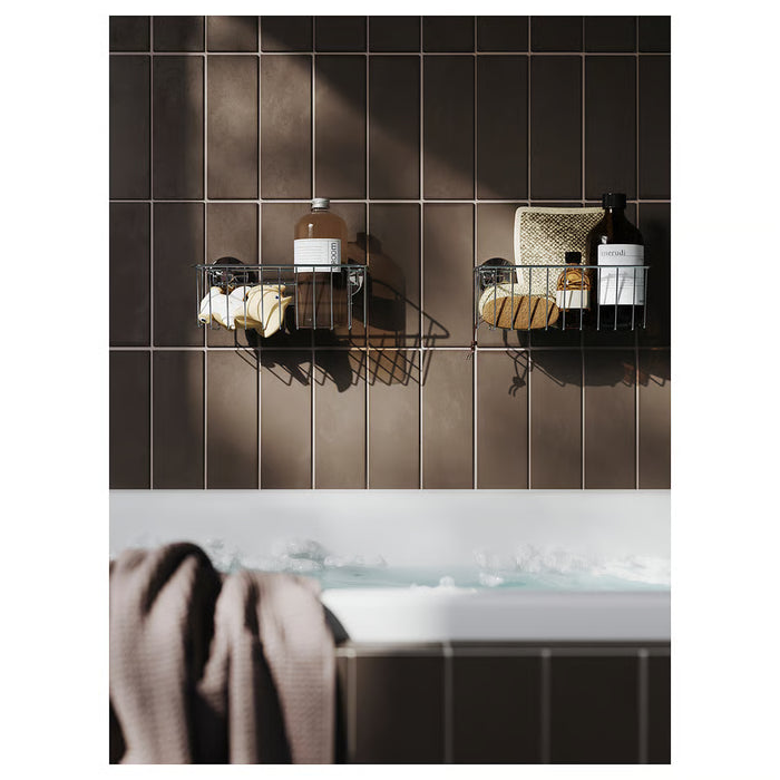  IKEA KROKFJORDEN shower basket mounted on white bathroom tile holding shampoo and soap bottles