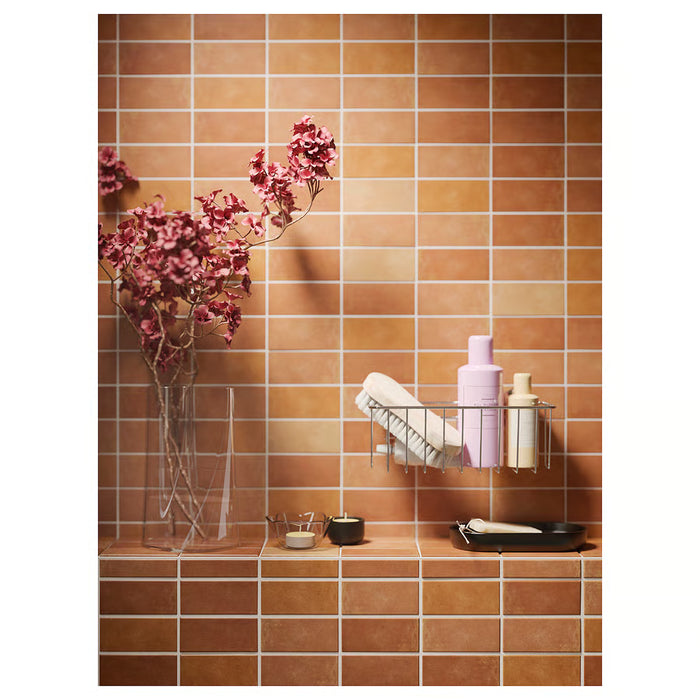 IKEA KROKFJORDEN shower caddy on tiled wall with toiletries organised neatly inside basket
