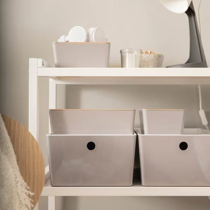 An IKEA storage box with a removable lid, made of sturdy and durable materials, and designed to help you keep your home organized and clutter-free