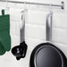 IKEA KUNGSFORS hooks on a wall in a modern kitchen, holding spatulas and ladles