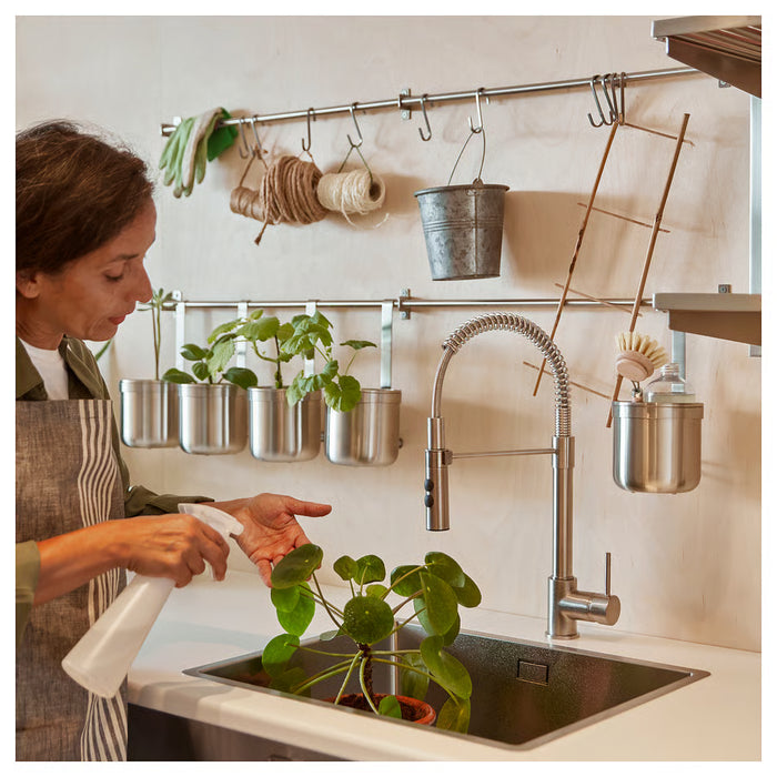 IKEA KUNGSFORS rail mounted above sink with kitchen accessories in modern home kitchen