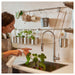 IKEA KUNGSFORS rail mounted above sink with kitchen accessories in modern home kitchen