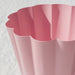 Close-up of IKEA KVASTSPIREA pink pot showing rounded wave texture and powder-coat finish