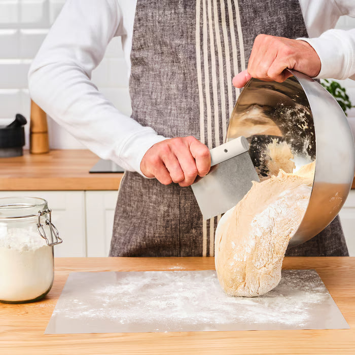 IKEA LÄTTBAKAD dough cutter styled with vintage scale wooden bowl and flour sack on rustic table