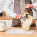 IKEA LÄTTBAKAD dough cutter styled with vintage scale wooden bowl and flour sack on rustic table