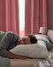 IKEA LAPPTÅTEL high pillow on bed with blue wall and wooden headboard bedroom setting