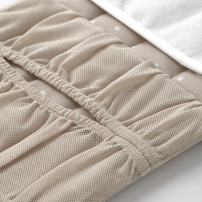 IKEA LEN babycare mat beige with two mesh side pockets holding diapers and wipes