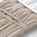 IKEA LEN babycare mat beige with two mesh side pockets holding diapers and wipes