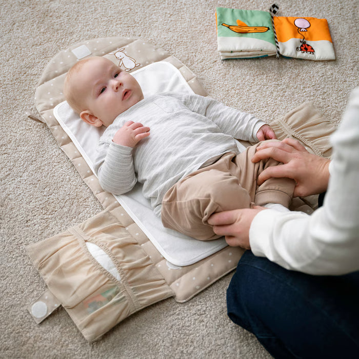 IKEA LEN foldable babycare mat laid flat showing full length and compact form for travel use