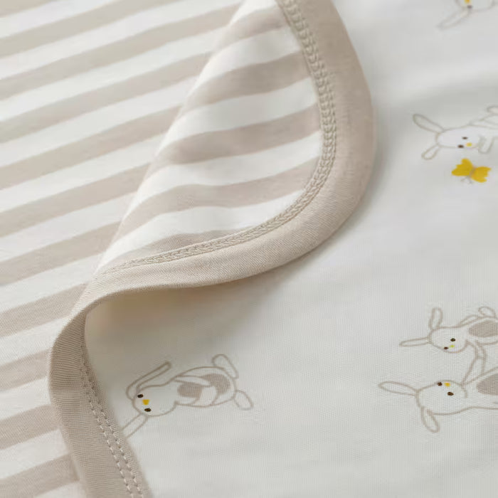 IKEA LEN organic cotton baby blanket bunny side draped over pram outdoors