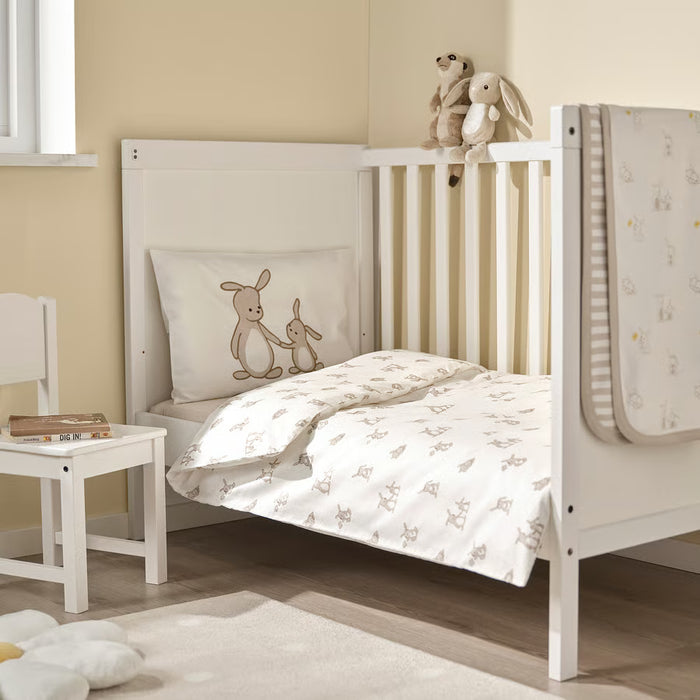 IKEA LEN baby bedding set in white bunny print styled in a soft nursery room setting