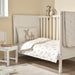 IKEA LEN baby bedding set in white bunny print styled in a soft nursery room setting