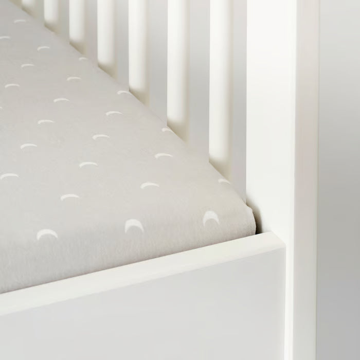  Close-up of IKEA LENAST cotton fabric soft dotted and moon print texture