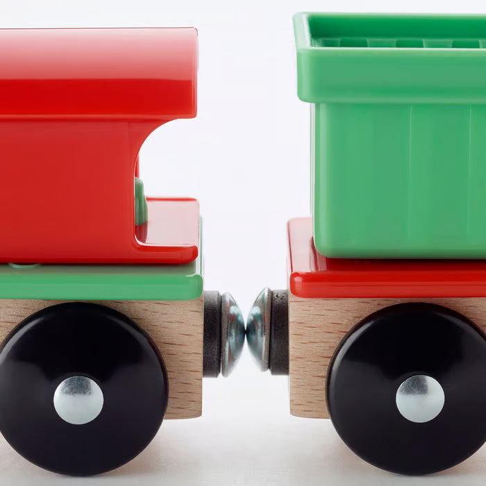 IKEA LILLABO red and green magnetic wooden train cars with black wheels connected together