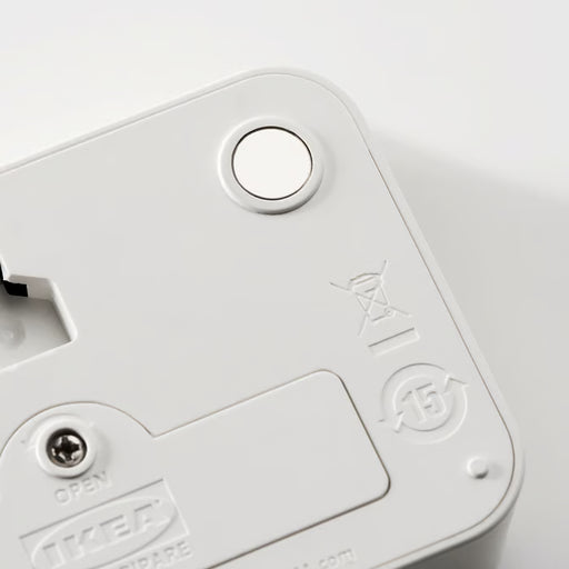  Close-up of IKEA LJUNGPIPARE white digital clock showing round buttons and display symbols