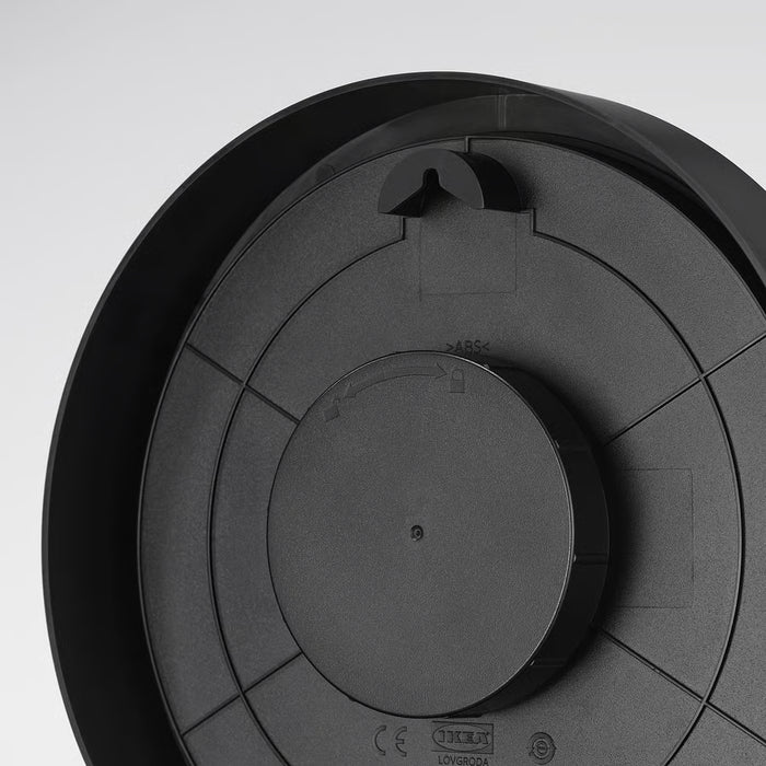 IKEA LÖVGRODA black clock rear view showing wall mount and splash-proof back cover