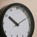  IKEA LÖVGRODA black clock close-up showing thick hour hand and clear dial numbers