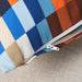  Close-up of IKEA LÖVNATURSKOG cushion cover brown blue cotton fabric texture and colour blocks
