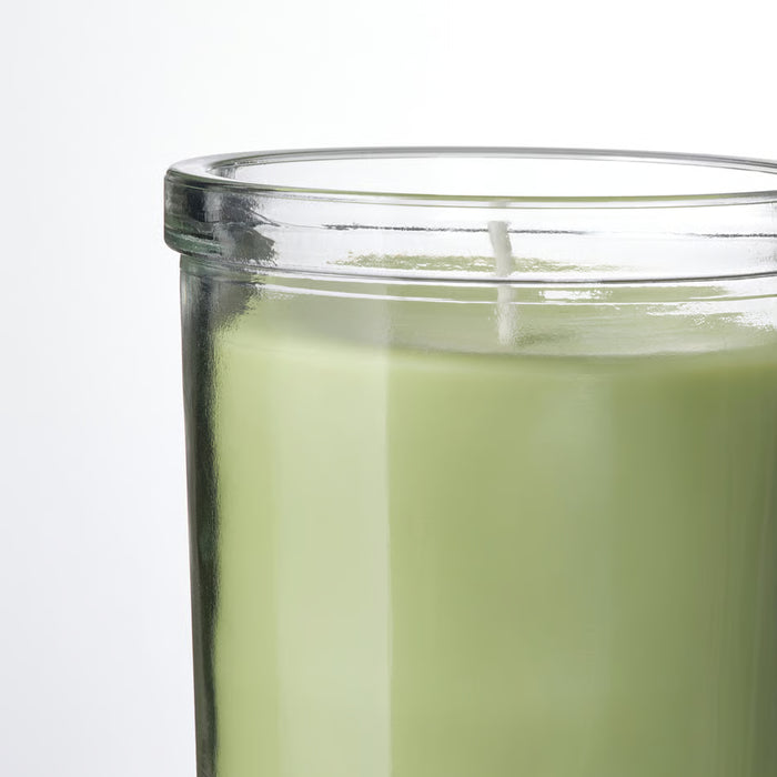 IKEA LÖVSKOGSLUND scented candle in clear glass jar with triple wick, light green hue