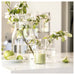 IKEA LÖVSKOGSLUND candle on kitchen counter with white flowers and green apples