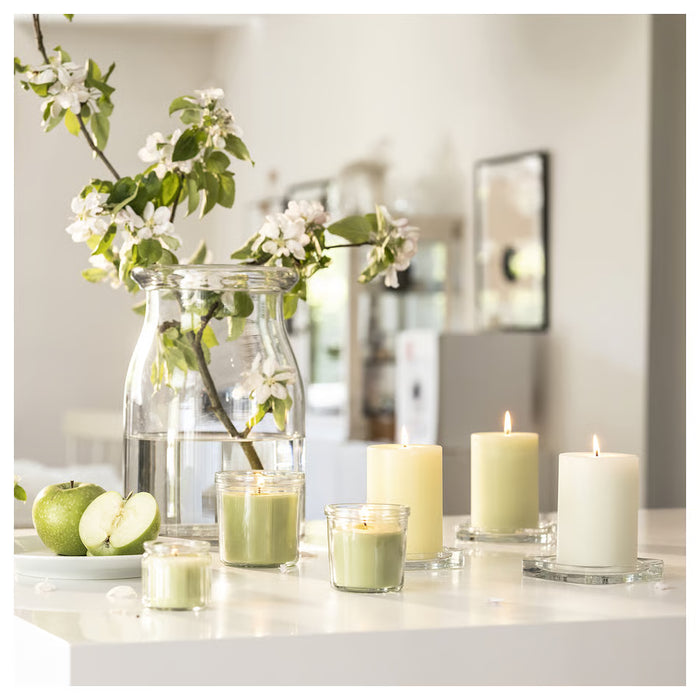 IKEA LÖVSKOGSLUND apple scented candles with fresh flowers on white countertop