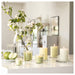 IKEA LÖVSKOGSLUND apple scented candles with fresh flowers on white countertop