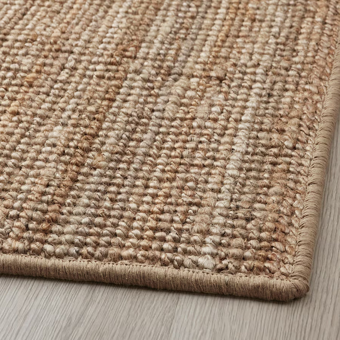 IKEA LOHALS beige jute door mat close-up weave lying on wooden floor