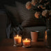 IKEA LOTSFÅGEL solid pine candle lid used as a coaster under a lit candle