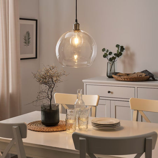 Modern clear globe LED bulb by IKEA, 150 lumens for stylish lighting.