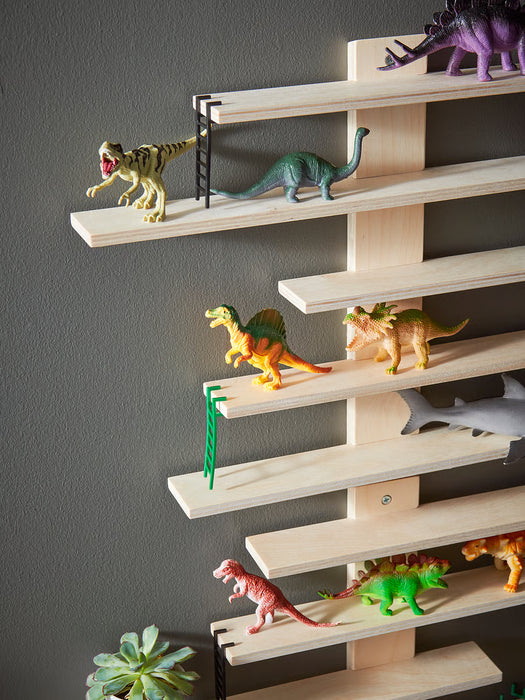 IKEA LUSTIGT wall shelf with toys and ladder details, side-angle view showing shelf depth