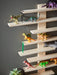 IKEA LUSTIGT wall shelf with toys and ladder details, side-angle view showing shelf depth