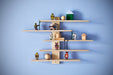: IKEA LUSTIGT wall shelf styled with toys in a children's room, house-shaped wooden display unit