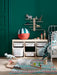  IKEA LUSTIGT wall shelf in a vibrant green kids room styled with dinosaur toy and colourful rug
