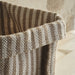 Close-up of IKEA MÄVINN handmade jute basket showing woven texture and beige color. Size: 30x30x35 cm.
