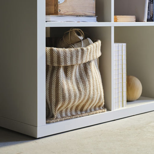 A large, round handmade jute basket in natural beige, part of IKEA’s MÄVINN collection, ideal for storing laundry, toys, or blankets. Dimensions: 30x30x35 cm.