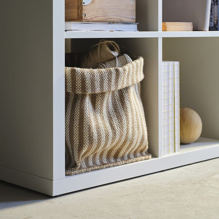A large, round handmade jute basket in natural beige, part of IKEA’s MÄVINN collection, ideal for storing laundry, toys, or blankets. Dimensions: 30x30x35 cm.