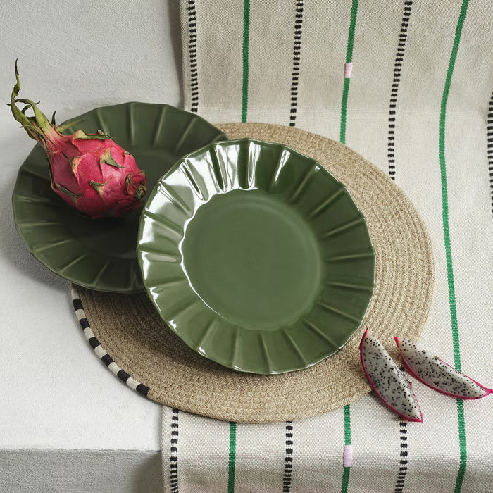 IKEA MÄVINN green stoneware side plate on woven placemat scalloped edge
