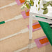 IKEA MÄVINN beige green jute rug in living room setting near table and plant