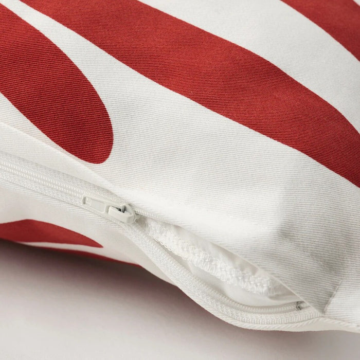 "Close-up of the IKEA MAJSMOTT Cushion Cover showing off-white fabric with red detailing 70563440