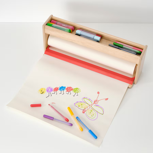 Child using MÅLA paper holder with crayons and markers 50488970

