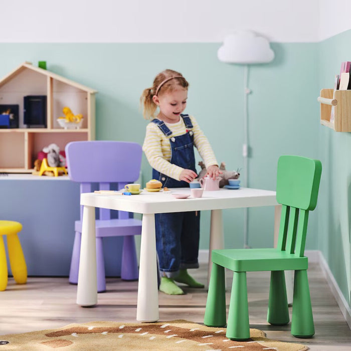 Green MAMMUT children's chair by IKEA, ideal for outdoor and indoor activities.