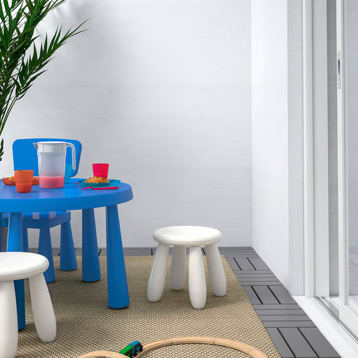 IKEA MAMMUT white stool in kids play area with blue table colourful stools and cups on grey rug