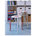 Three IKEA MARIUS white stools stacked neatly against a bookshelf showing stackable storage