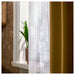 IKEA MATILDA sheer curtains paired with room darkening curtains on window