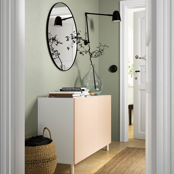 IKEA MEJARP birch legs elevating a white BESTÅ cabinet in a hallway with sage green wall and mirror